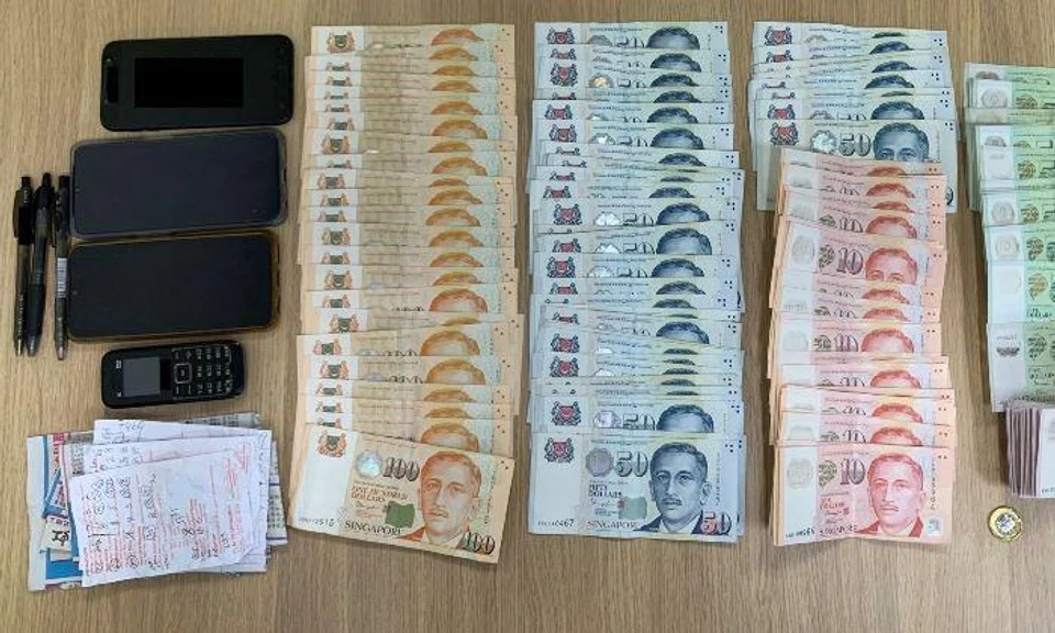Cash amounting to about $6,200, six mobile phones and betting-related paraphernalia were seized as case exhibits.