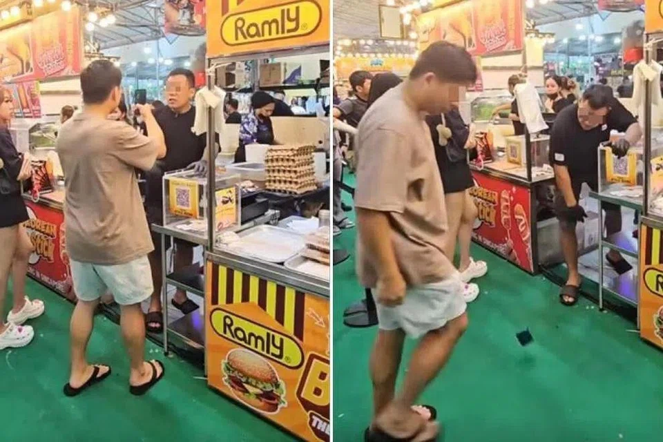 The stall owner smashes the customer's phone onto the ground in the staged video.