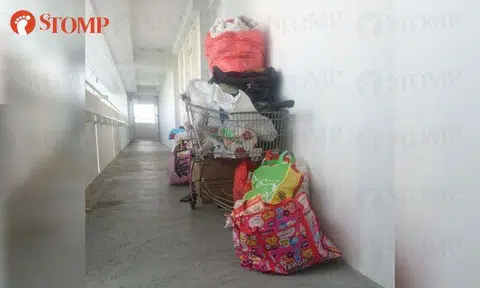 The corridor of Block 63 Sims Place is a common area, not your private storeroom!