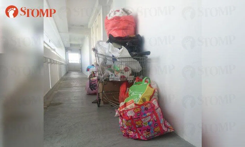 The corridor of Block 63 Sims Place is a common area, not your private storeroom!
