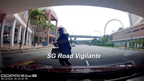 Jaywalker with child confronts driver after near-miss at Raffles Boulevard
