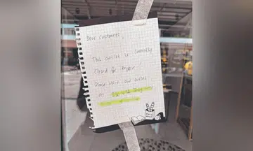 Notice outside hair salon announcing renovations