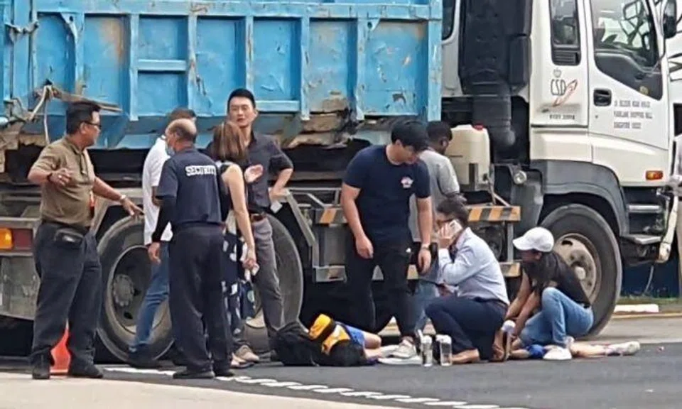 A video of the accident's aftermath posted online shows people gathered around the two girls lying on the road next to a lorry. 