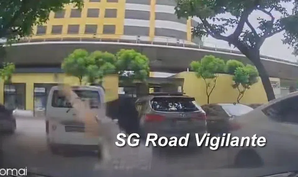 A woman falling to the ground after an accident with a reversing car in Boon Lay on March 29.