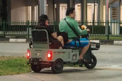 A couple was spotted in a two-seater PMA, raising questions about the legality of the device.