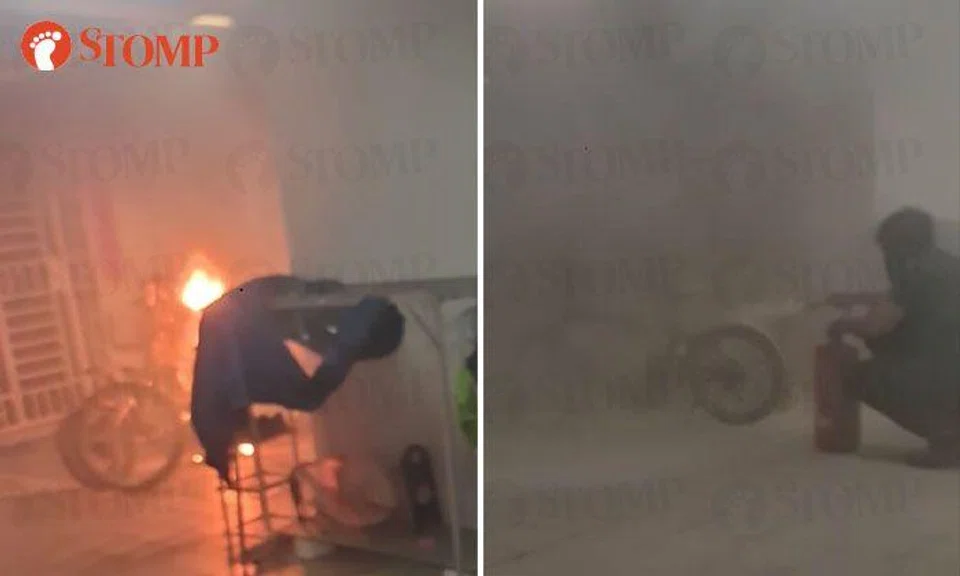 Members of public help put out fire after PAB bursts into flames outside Buangkok HDB unit