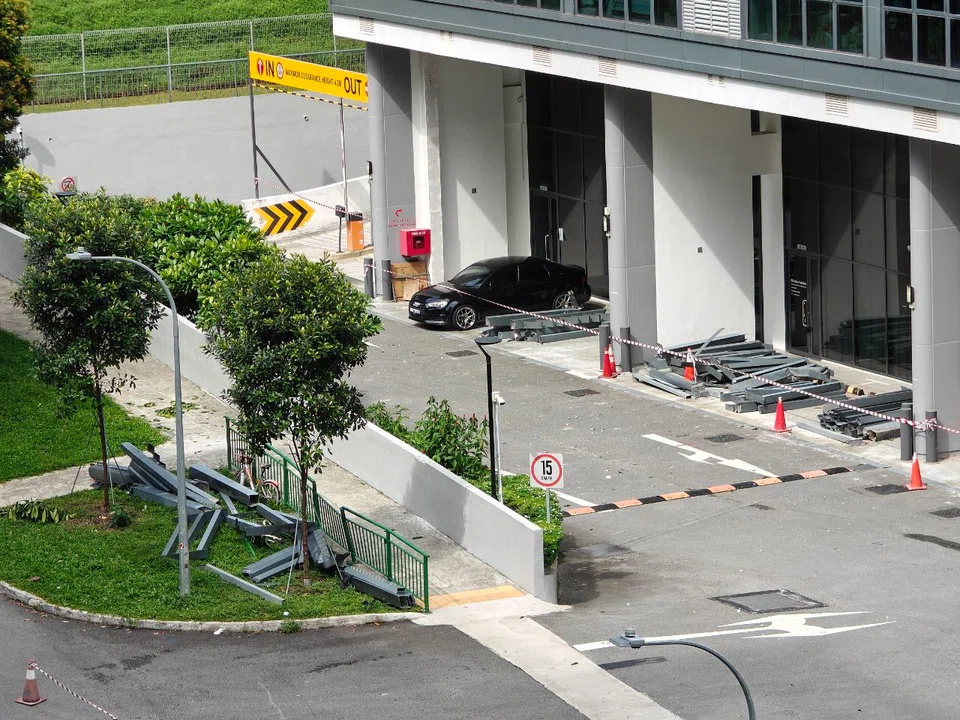 The metal debris was moved off the road after falling from an external structure at Inspace at 24 New Industrial Road.