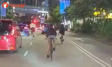 Reckless cyclists weave through traffic along Orchard Road