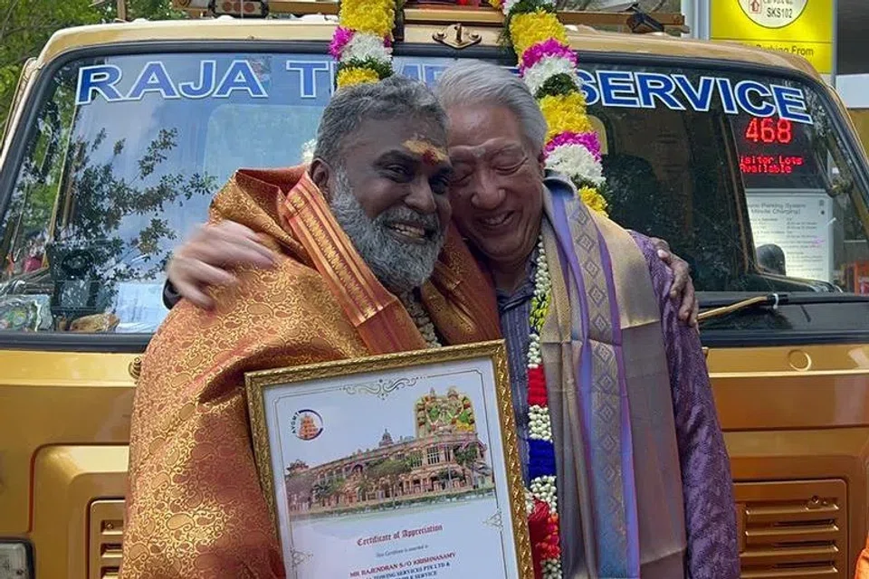 Mr Rajendran Krishnasamy with Senior Minister Teo Chee Hean after being honoured.