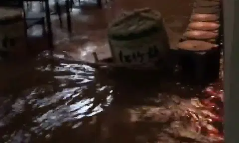 Owner pleads with customers to cancel reservations -- after heavy rain turns restaurant into 'Singapore River'