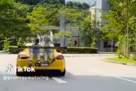 Police probe after video of moving Porsche with two children sitting atop rear emerges