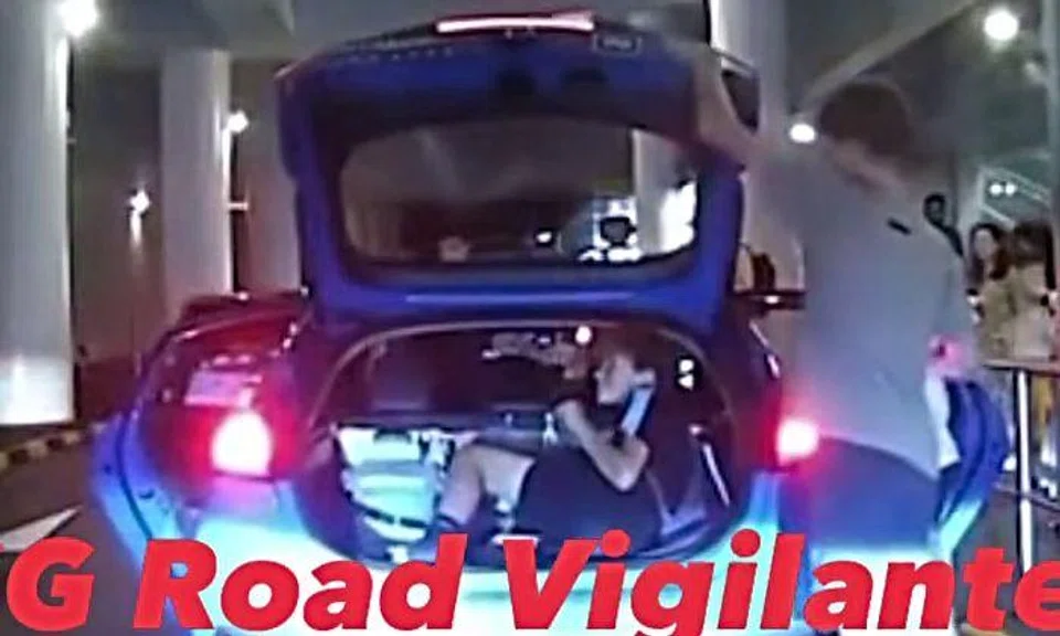 In a video posted on Singapore road safety Facebook group SG Road Vigilante on April 12, four young men are seen near a blue ComfortDelGro taxi at a VivoCity pick-up point. Two of them are seen getting into the taxi while one of them jumps into the boot and another closes the boot before getting into the front passenger seat.