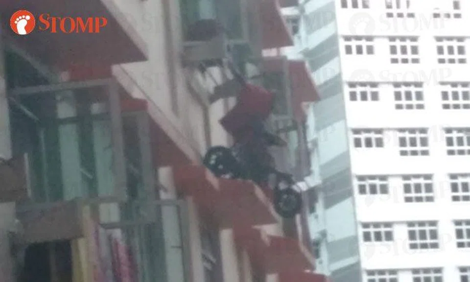 Bukit Batok resident hanging stroller outside kitchen window is an accident waiting to happen