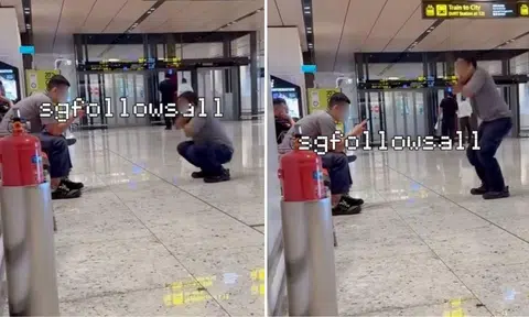 man performs squats in Changi Airport