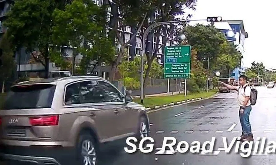 Pedestrian left stunned as Audi runs red light in Tampines