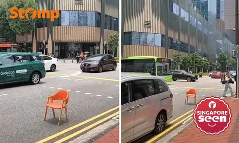 Random orange chair blocks road in Chinatown