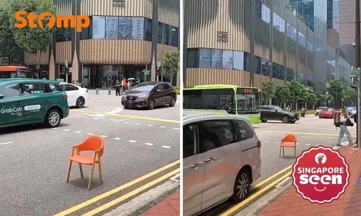 Random orange chair blocks road in Chinatown