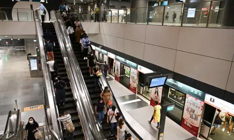 Woman on escalator hears commotion, turns to see man confront another for taking upskirt videos of her