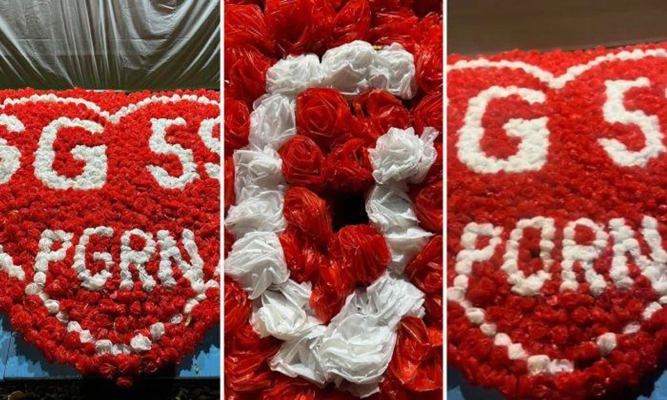 The heart-shaped decoration by the Pandan Gardens Residents’ Network (PGRN) was supposed to say "SG 59 PGRN". But one of the flowers had been moved to change the G to an O. So it said "SG 59 PORN" instead.