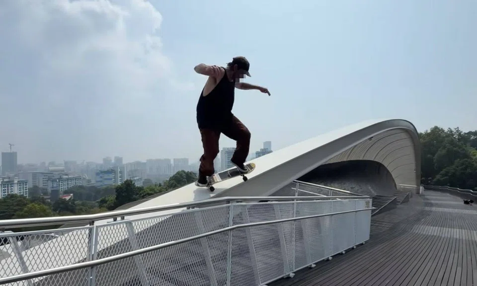 Popular American skateboarder skates dangerously along arch at Henderson Waves bridge