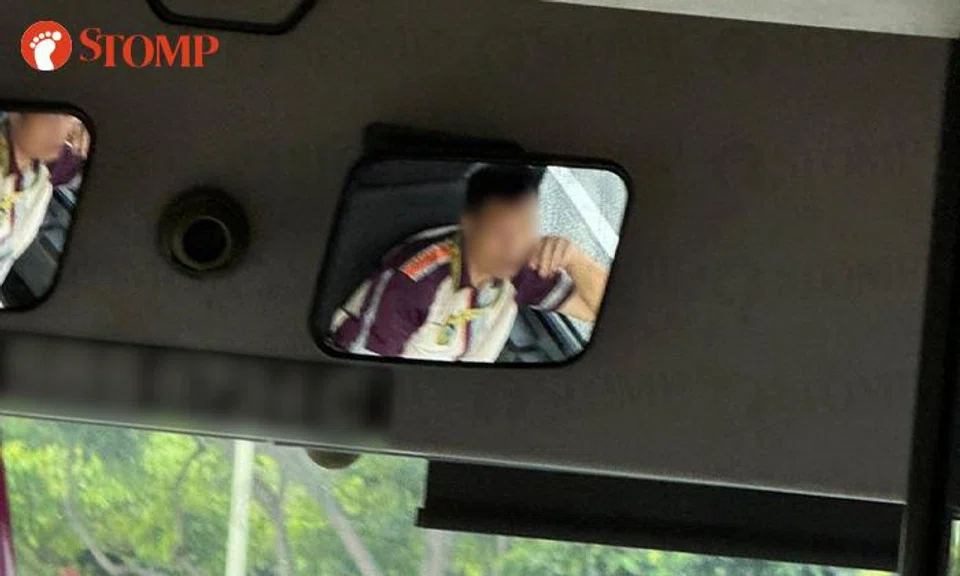 bus driver drives with arm on window