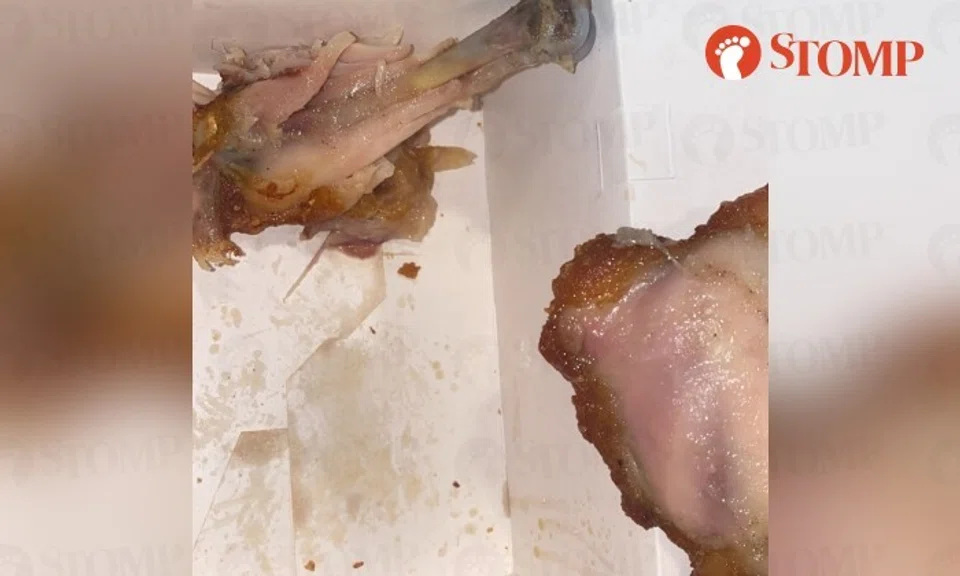 The photos show two pieces of fried chicken with pinkish meat under the deep-fried skin.