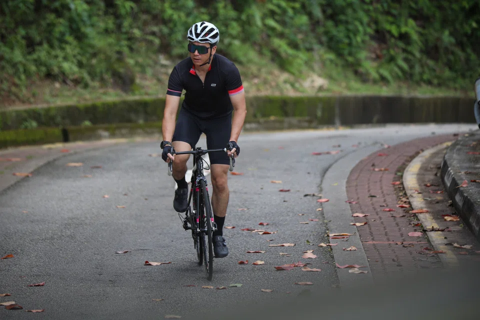 Mr Ang's girlfriend trained with him on the open roads, scanning for cars as his limited neck mobility made quick backward glances difficult.