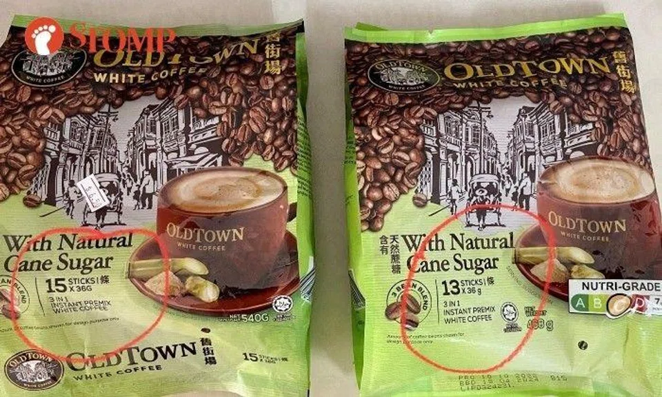 Two similar-looking but different packs of Old Town White Coffee With Natural Can Sugar 3-in-1 instant premix.