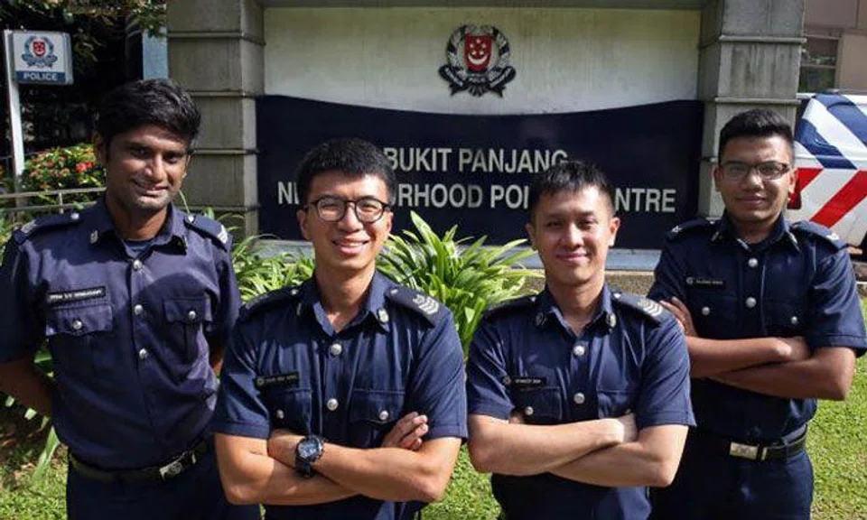 (From left) Sergeant Prem Rengasamy, Staff Sergeant Chan Wai Hong, Staff Sergeant Stanley Koh and Special Constable Corporal Rajdave Singh helped pull a maid dangling off a fifth-storey ledge to safety at Bukit Panjang Ring Road on Dec 6, 2017.ST PHOTO: SEAH KWANG PENG