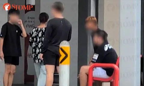 Group of boys caught smoking at Segar Road block, one flicks cigarette butt onto grass