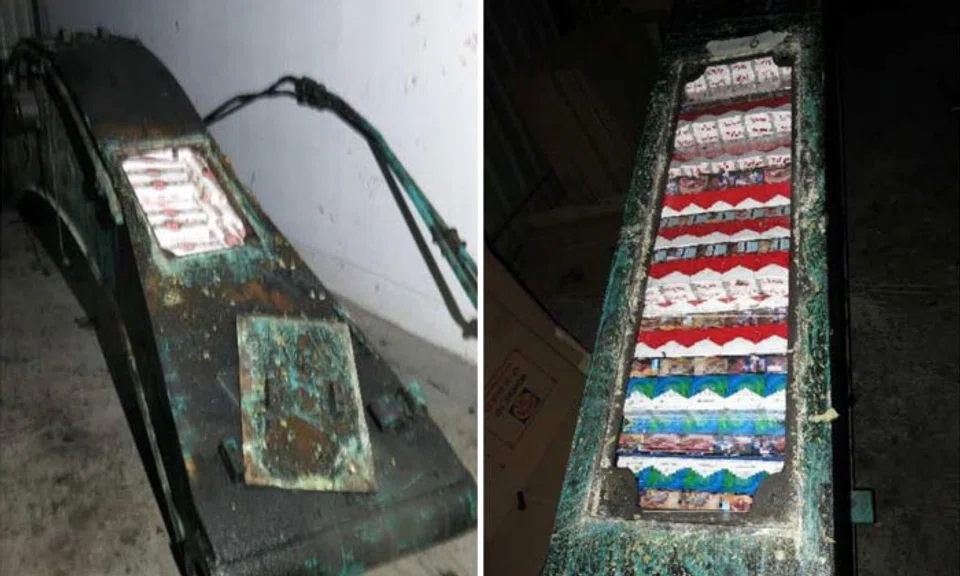 Duty-unpaid cigarettes concealed in the beams of excavator arms. The total duty and GST evaded amounted to $552,410. PHOTOS: SINGAPORE CUSTOMS