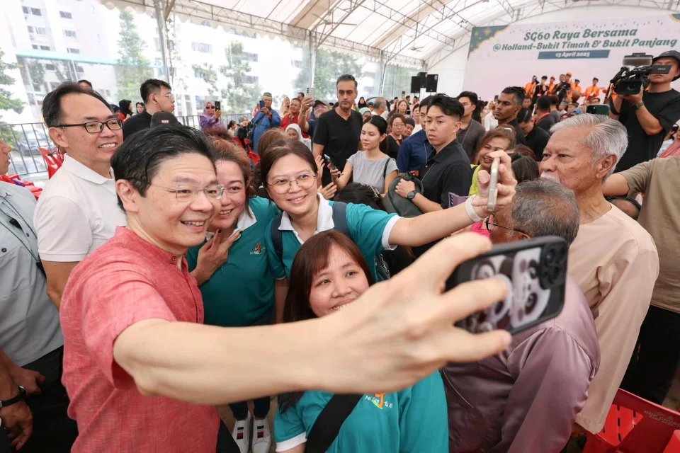 PM Lawrence Wong taking a wefie with Bukit Panjang residents during the SG60 Raya Bersama event on April 13.