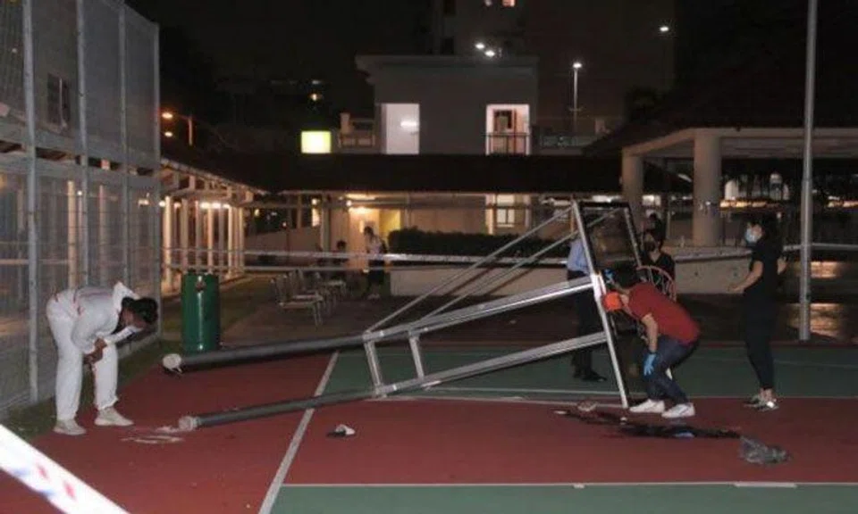 The police said they were called at about 8.45pm and found the injured teen next to a fallen basketball structure near Block 18 Bedok South Road. PHOTO: SHIN MIN DAILY NEWS