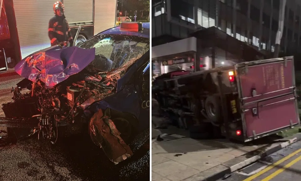 Videos show SCDF officers assessing a lorry which had tipped over onto its right side next to an Esplanade MRT station exit.