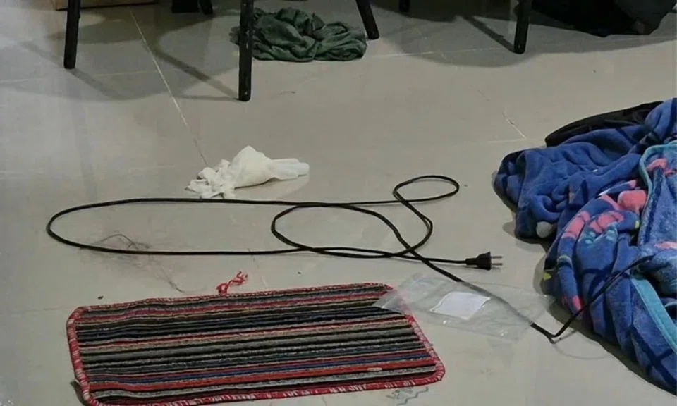 woman found naked, dead, Thailand murder, electric wire death