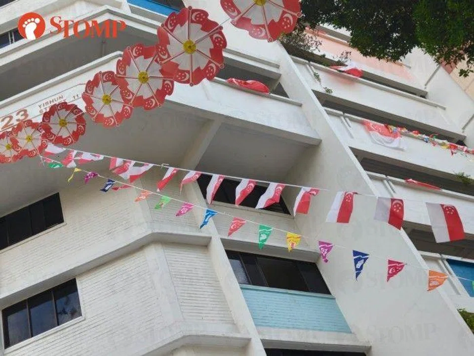 Upside down flags at Block 23 Yishun Street 11