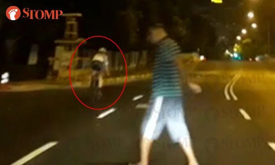 Auntie 'protects' cyclist riding in middle of the road, nearly hits jaywalker instead