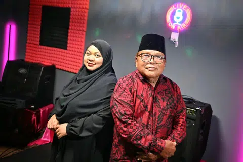  Mr Mohd Nazir Dolah with his daughter Irma Yanti. Much of his childhood was spent diving in the azure waters off Pulau Samulun and Pulau Merimau.