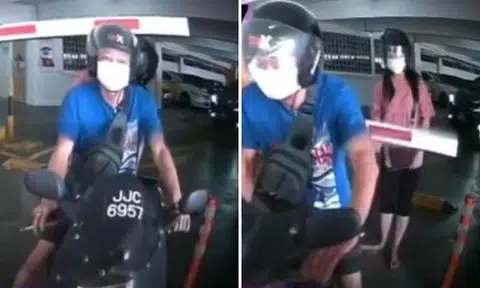 Biker tries to sneak out of carpark but barrier smacks pillion rider