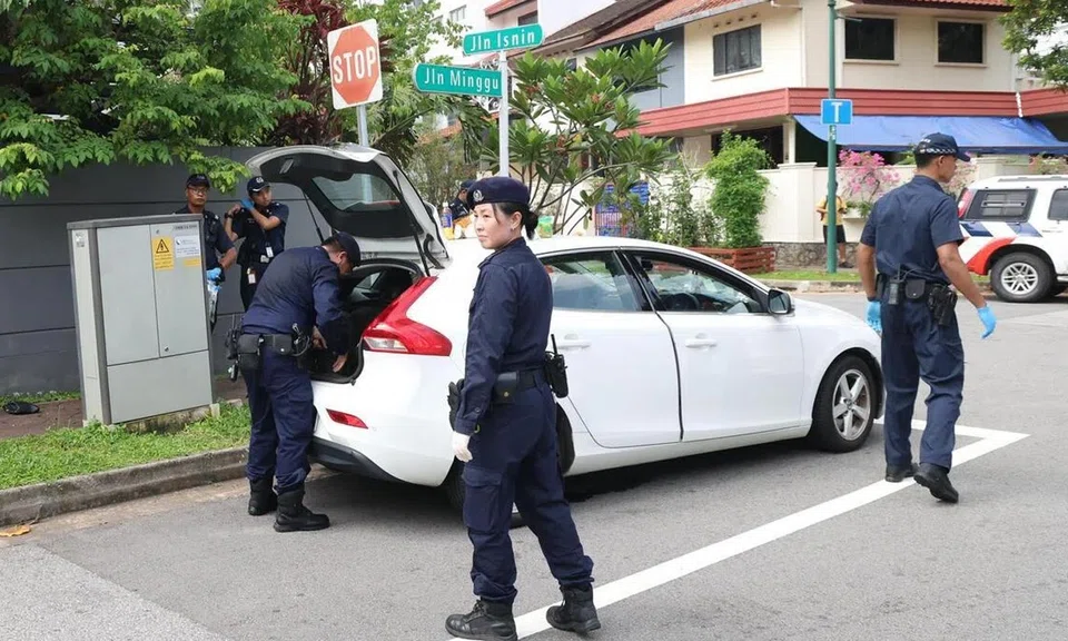 At about 11am on May 23, several police officers were seen inspecting items taken out of a white car parked illegally at an intersection in Jalan Minggu.