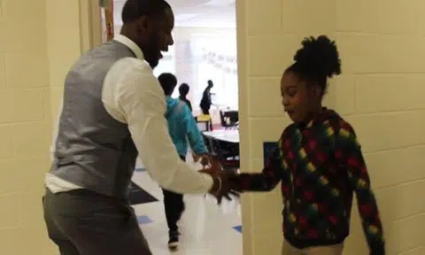 Coolest teacher ever has personalised handshake for every one of his students 