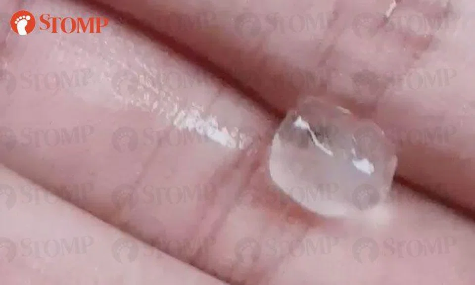 Stomper struck by hailstones along SLE during heavy rain on Tuesday