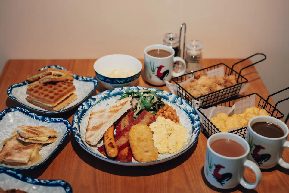 Tina's Cafe offers local staples such as kaya butter toast, nasi lemak and Tina's Breakfast Platter. 
