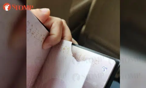 Another woman with mysteriously torn passport asked to pay $60 by JB customs officer