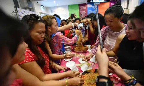 Huat Ah! Over 300 foreign domestic workers get a taste of CNY festivities