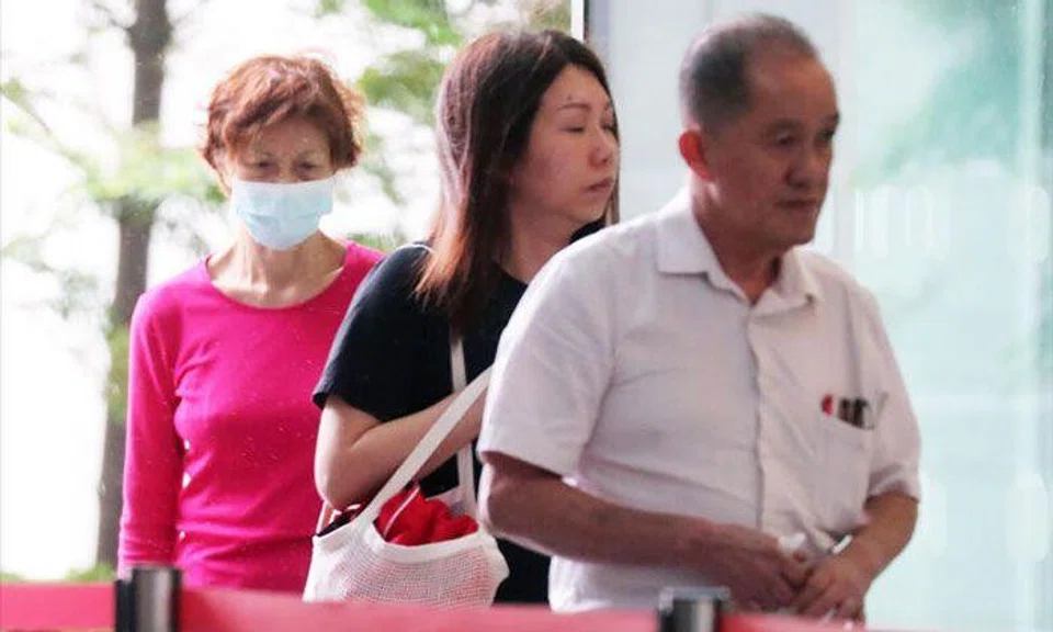 (From left) Tan Ai Tee, Tan Pei Ling and Tan Huat arriving at the State Courts, on March 7, 2023. ST PHOTO: KELVIN CHNG
