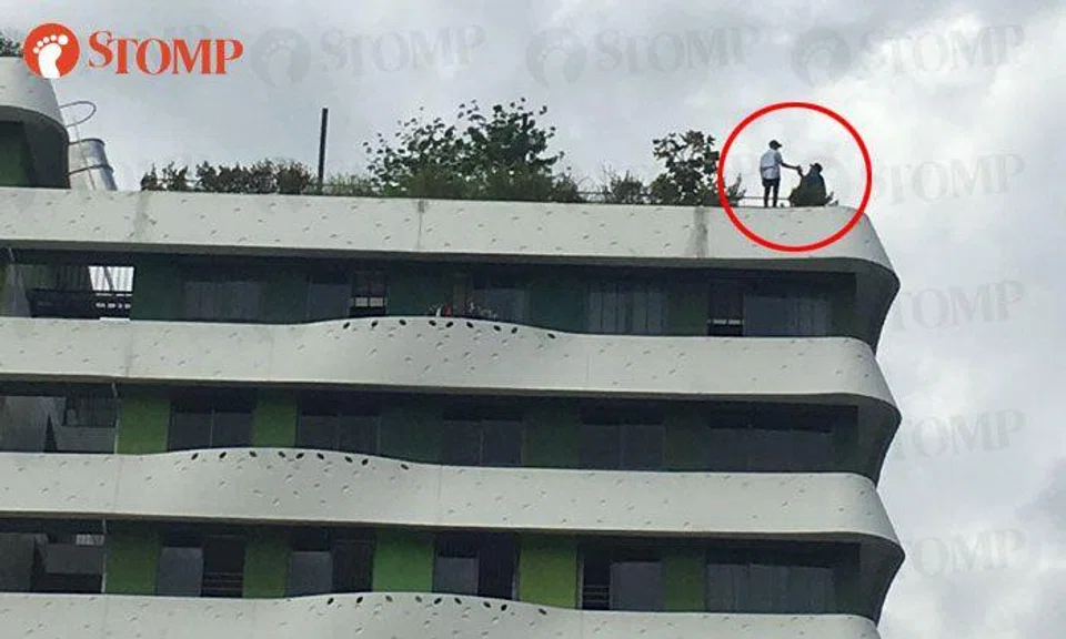 Youths seen posing and taking photos dangerously close to edge of roof at Punggol building