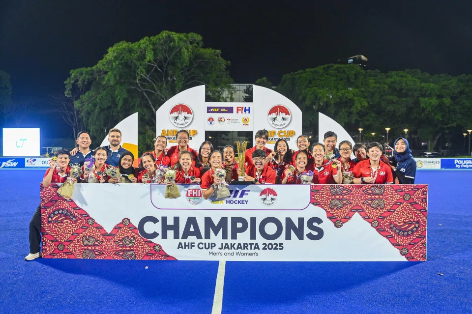 The Singapore women's hockey team celebrates their AHF Cup triumph after a penalty shoot-out victory over Chinese Taipei.