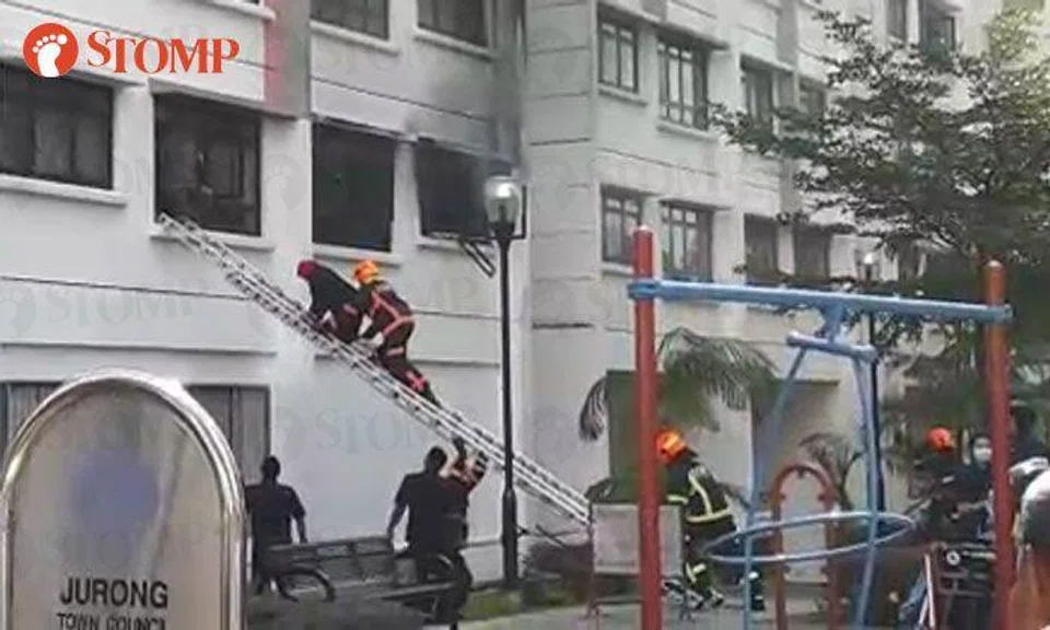 SCDF officers rescue residents after fire breaks out at Blk 372 Jurong East Street 32, 7 sent to hospital