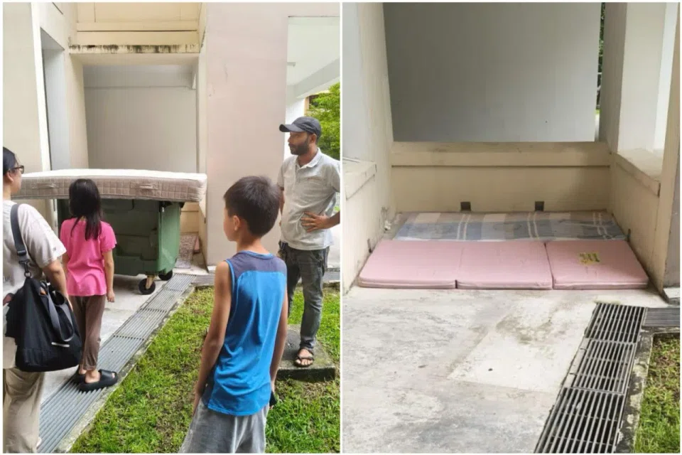 A crowd of concerned neighbours laid a mattress on the ground and on top of a rubbish bin in case the cat fell. PHOTOS: ELIZABETH GOH